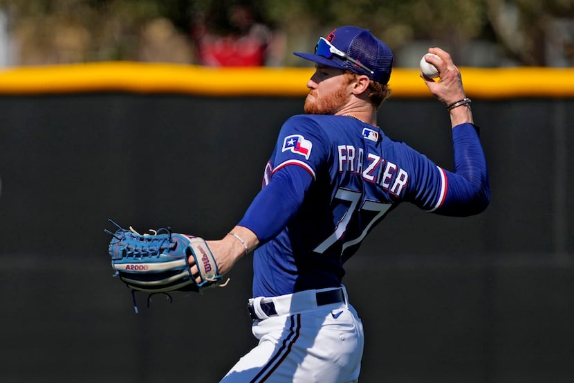 Texas Rangers Clint Frazier throws during spring training baseball practice Monday, Feb. 20,...