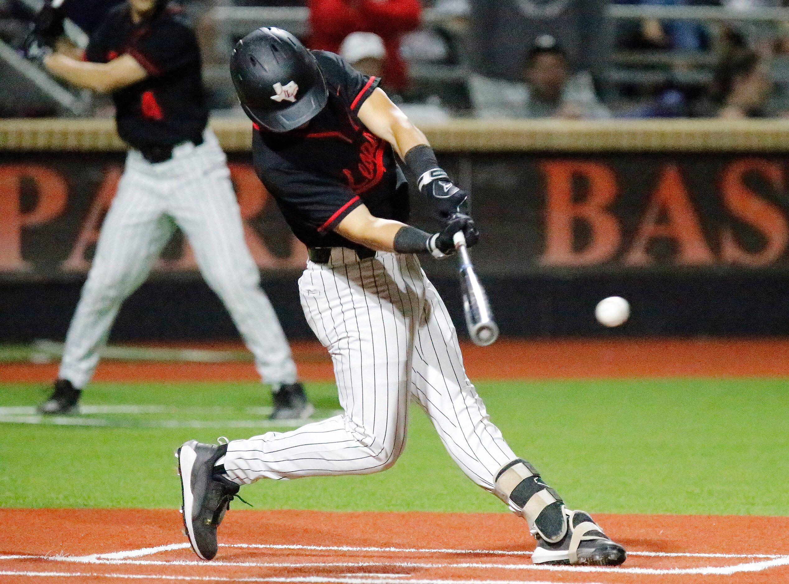 Lovejoy High School shortstop Kolby Branch (9) hits a double in the third inning as Lovejoy...