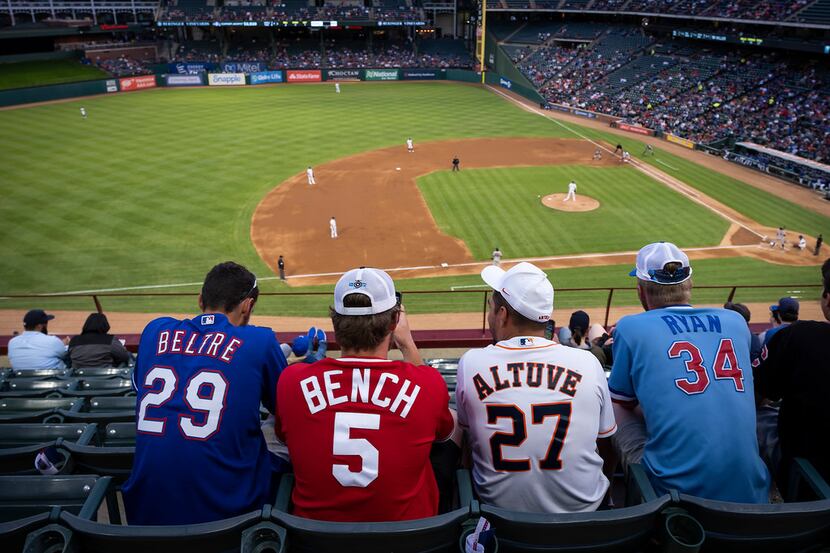 Fans wearing jerseys as varied as, from left, Adrian Beltre, Johnny Bench, Jose Altuve and...