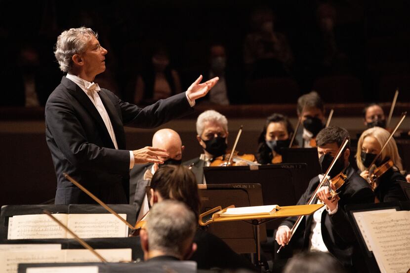 Fabio Luisi conducts the Dallas Symphony Orchestra, the members wearing masks as they perform.