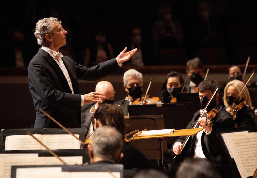 Fabio Luisi conducts the Dallas Symphony Orchestra, the members wearing masks as they perform.