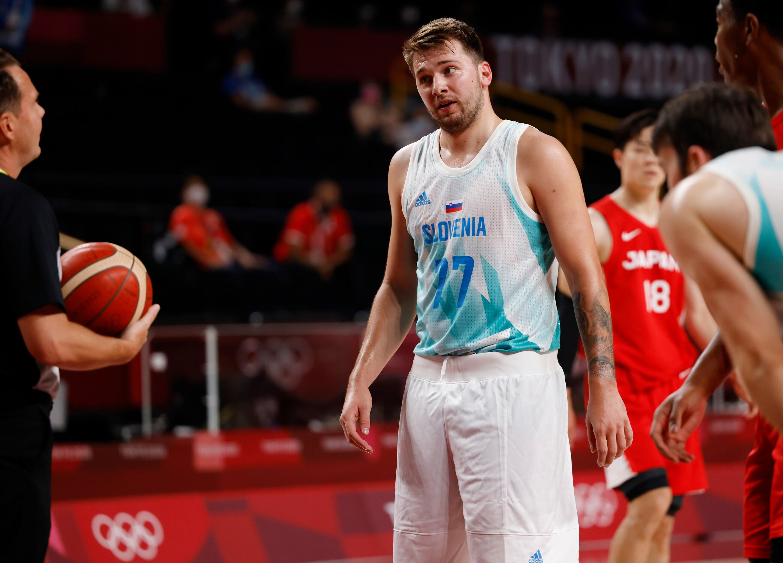 Slovenia’s Luka Doncic talks to a ref after a call in a basketball game against Japan during...