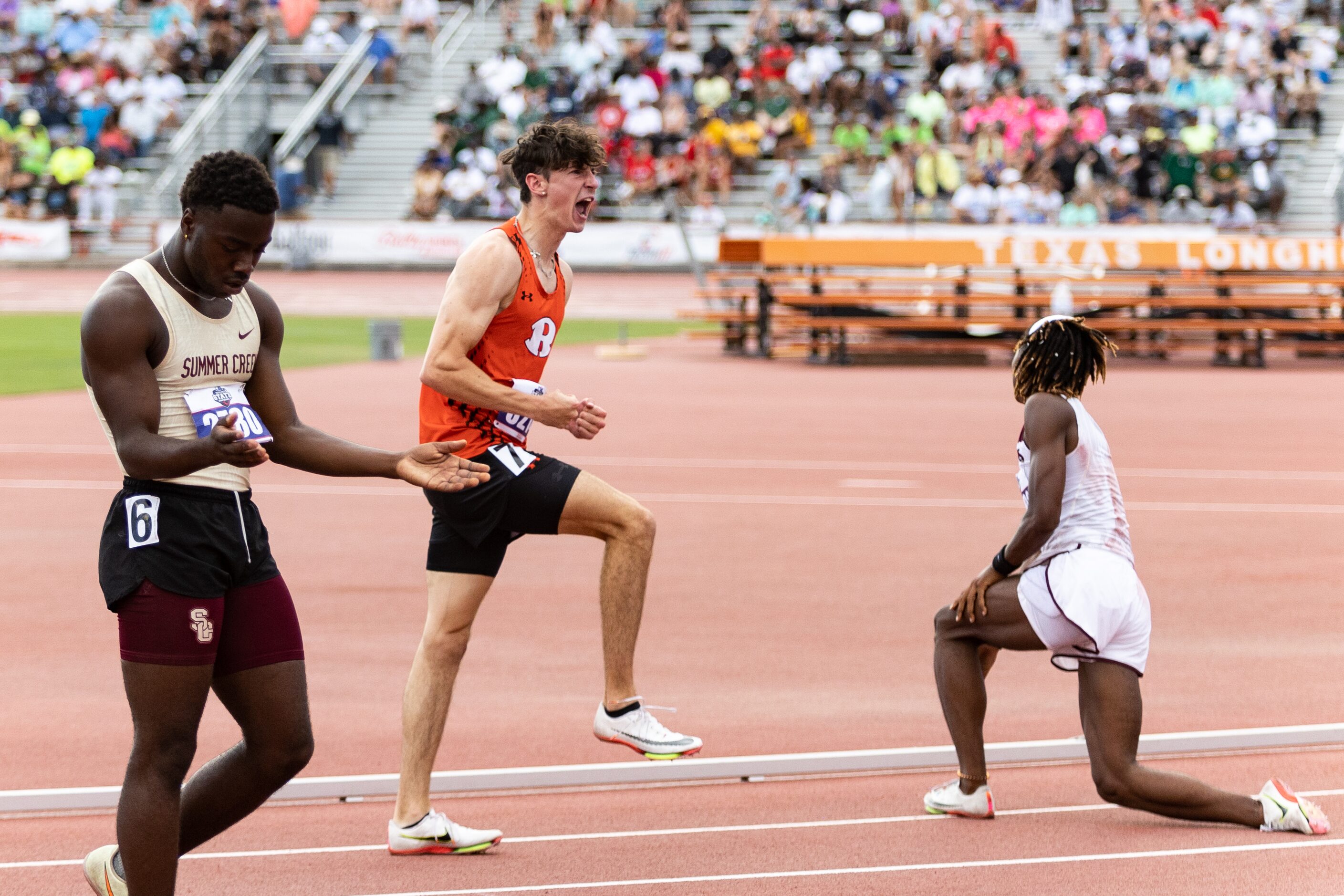 Samuel Alves of Rockwall, center, reacts to the results of the boys’ 110-meter hurdles at...