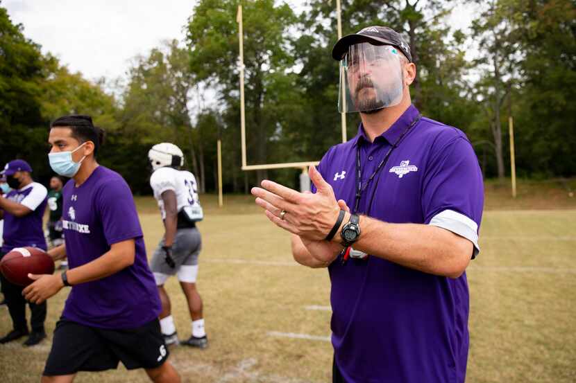 Stephen F. Austin Lumberjacks coach Colby Carthel wears a face shield during practice in...