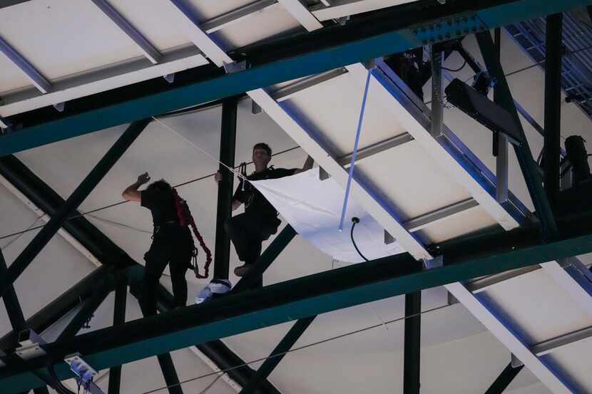Arena workers are seen working in the catwalk during the first quarter in Game 4 of the NBA...