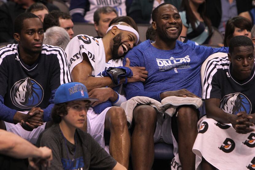 Dallas Mavericks shooting guard Vince Carter (25) jokes with Dallas Mavericks power forward...