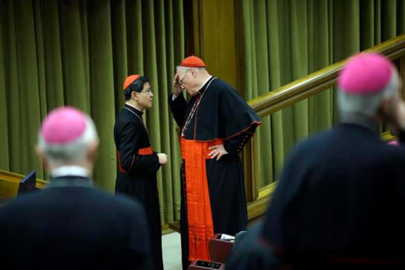 
Cardinals Luis Antonio Tagle of Manila (left) and Timothy Dolan of New York conferred...