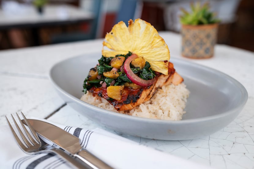 Salmon al Pastor - achiote grilled salmon, sautéed kale, white rice, grilled pineapple and...