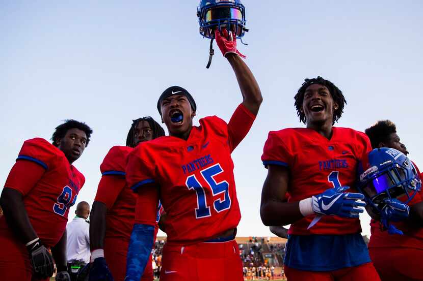 Duncanville wide receiver Marquelan Crowell (15) pumps up his team mates before a high...