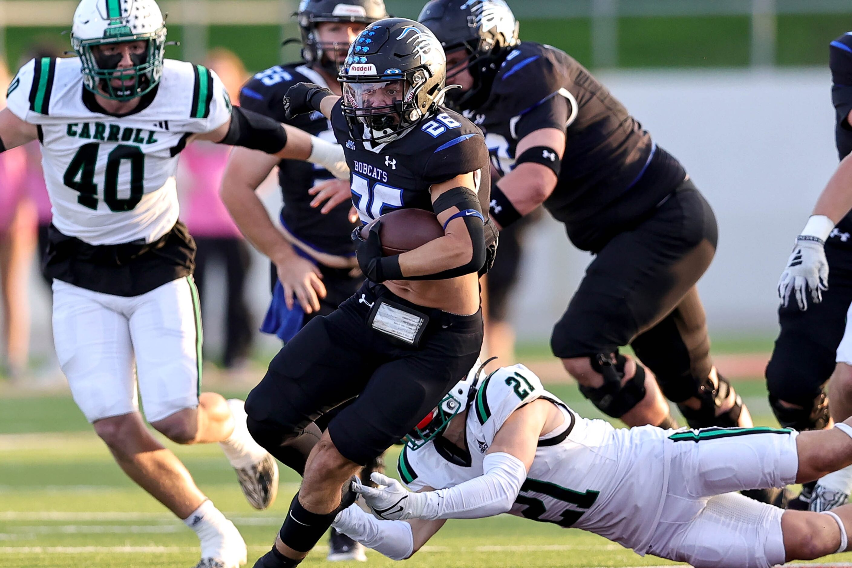 Byron Nelson running back Tucker James (26) breaks free from Southlake Carroll defensive...