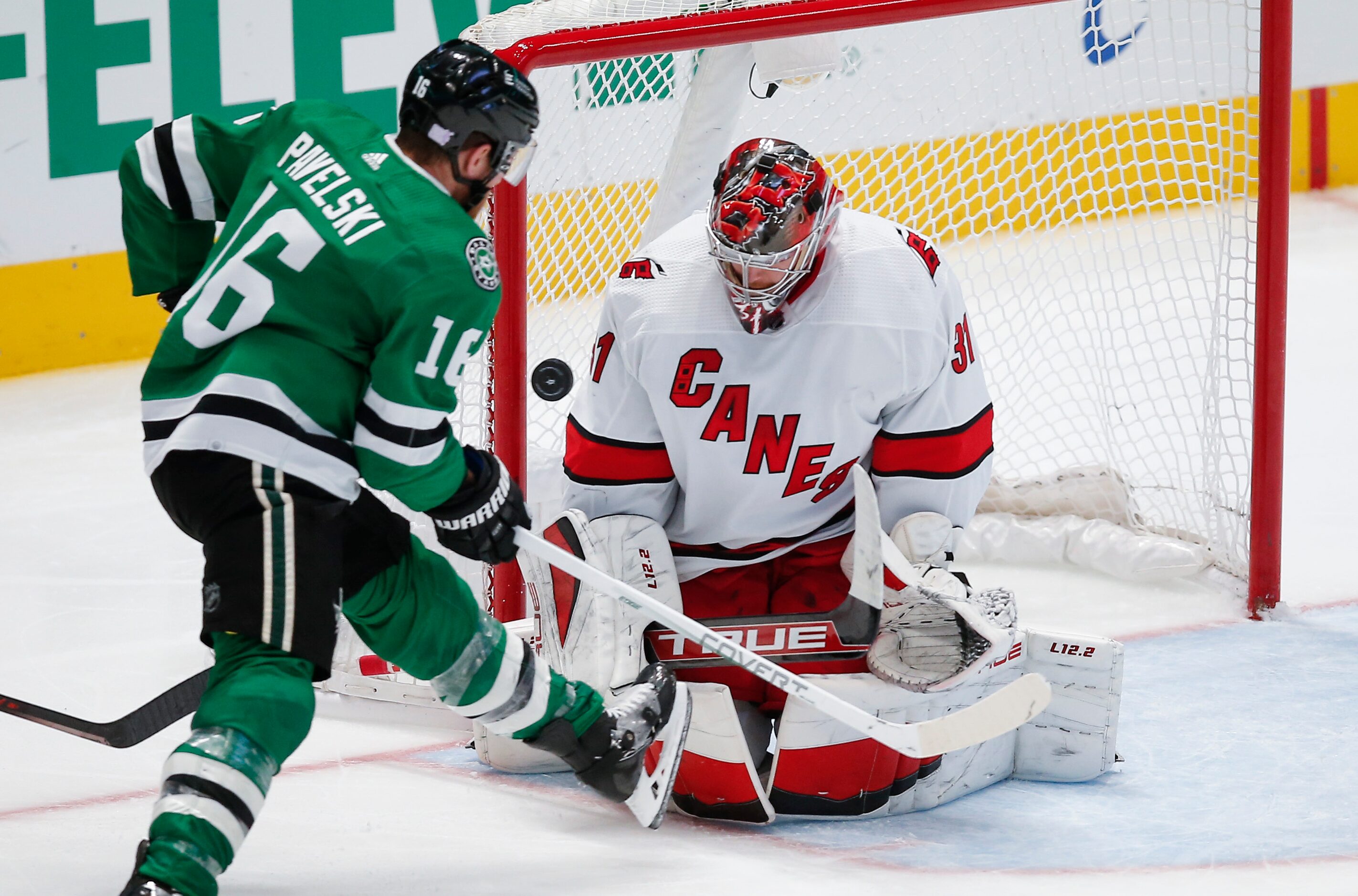 Dallas Stars forward Joe Pavelski (16) tips a shot past Carolina Hurricanes goaltender...