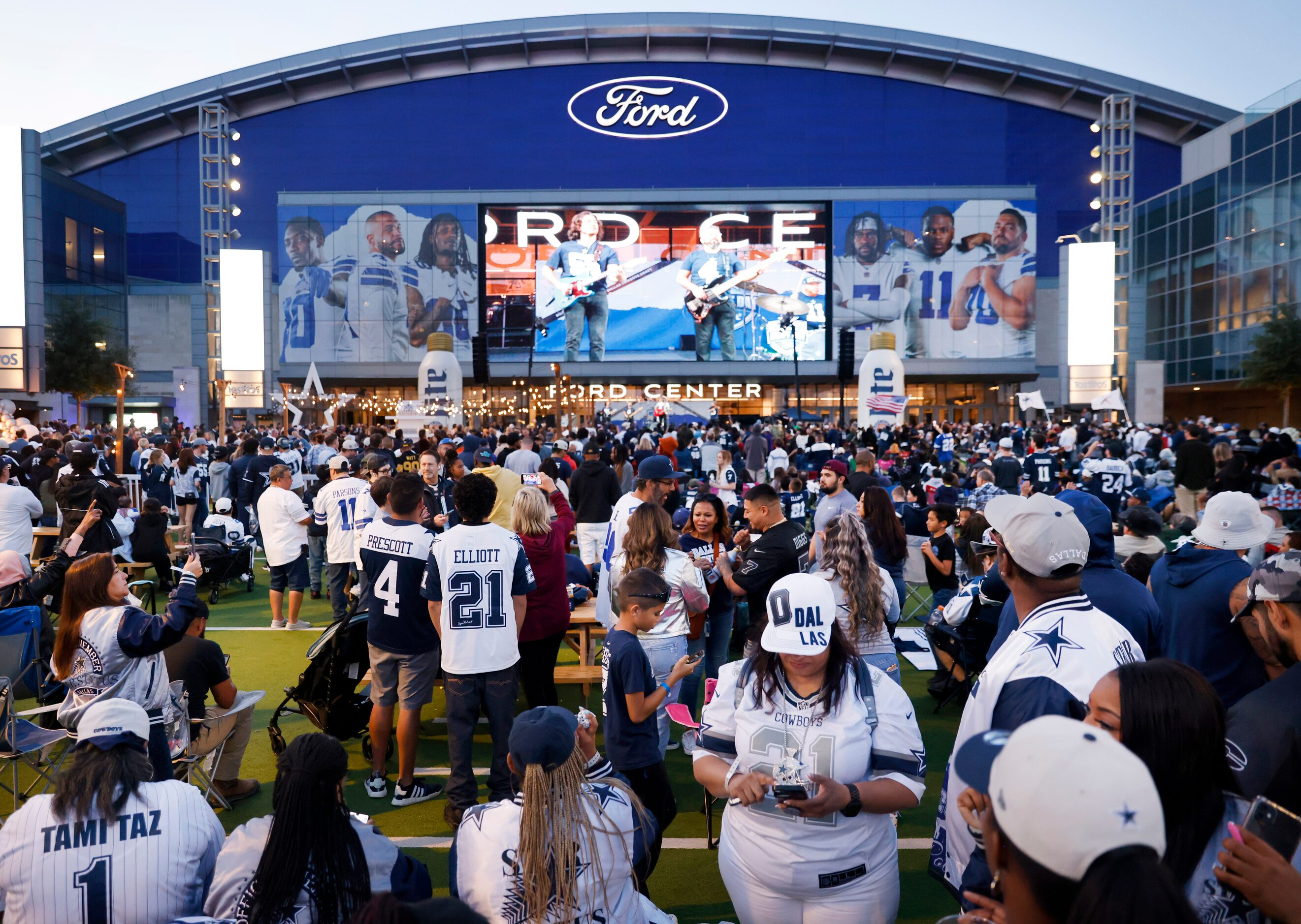 Dallas Cowboys fans gather for a draft party on the Ford Center plaza at The Star in Frisco,...