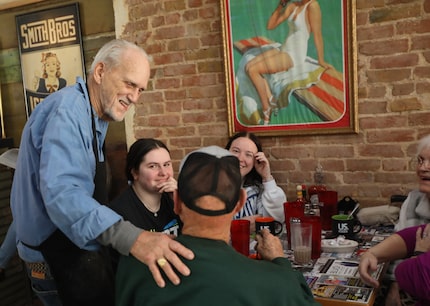 Bill Smith talks to customers on opening day at his new restaurant. The historical district...