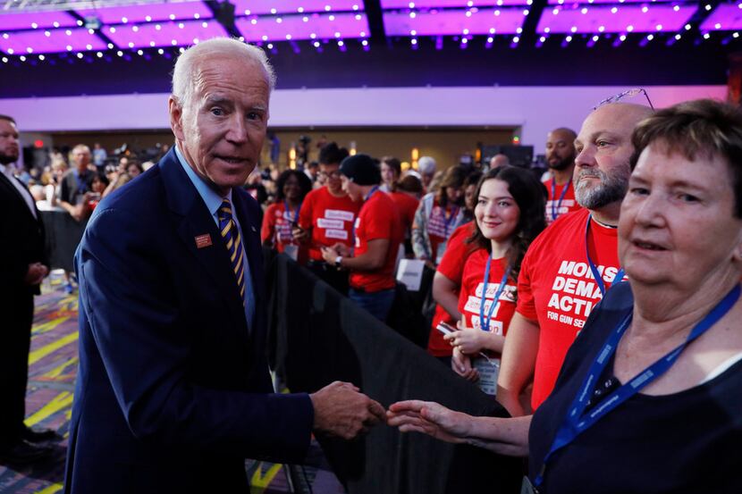Democratic presidential candidate Joe Biden greets audience members after speaking at the...
