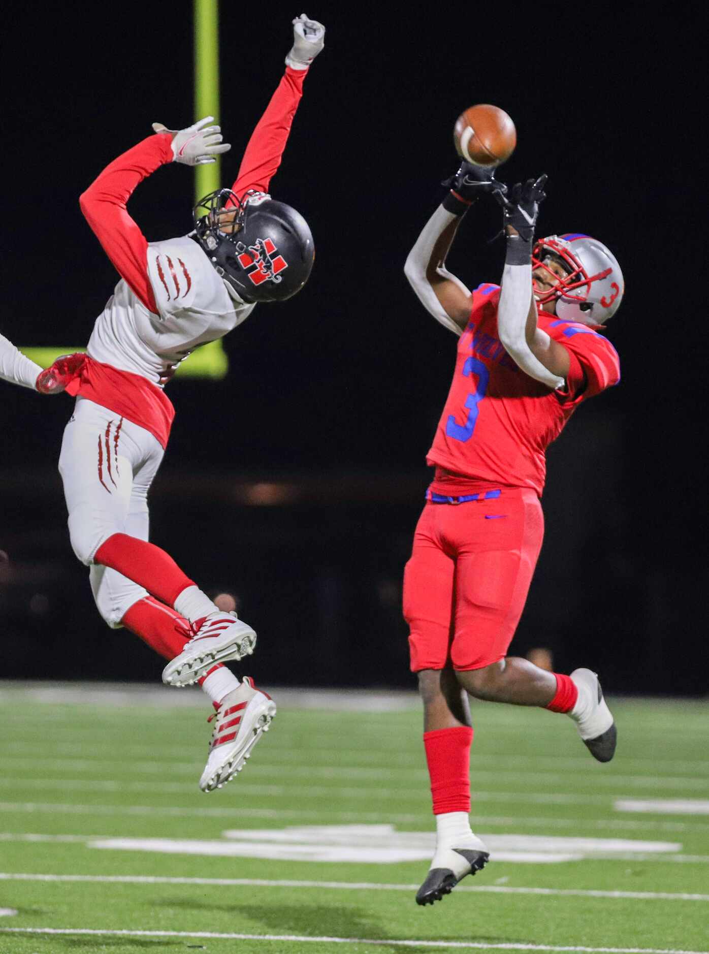 Spruce wide receiver Adrian Wickware (3) drops a pass over Hillcrest defensive back Reggie...