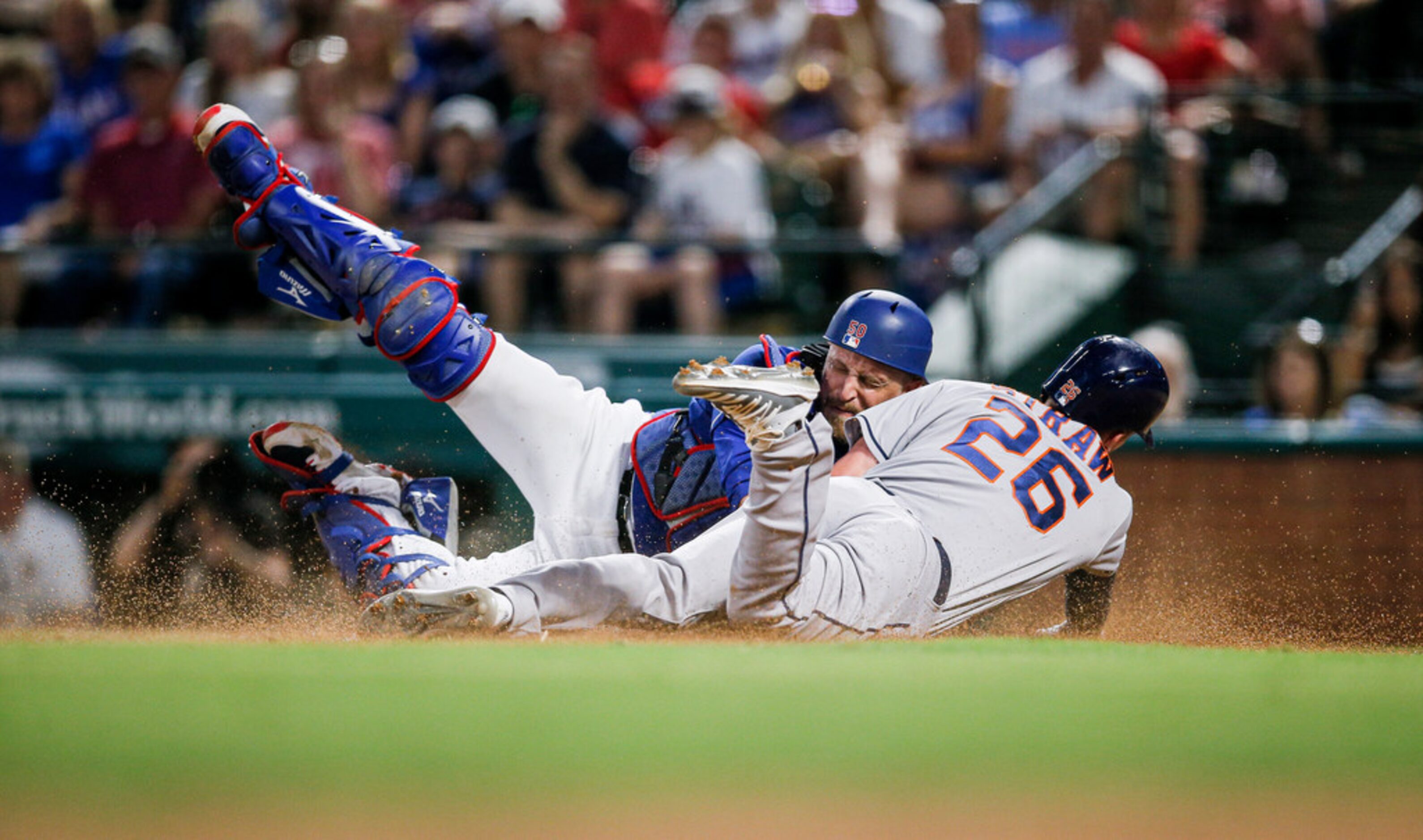 Texas Rangers catcher Tim Federowicz, left, tags out Houston Astros' Myles Straw (26) at...