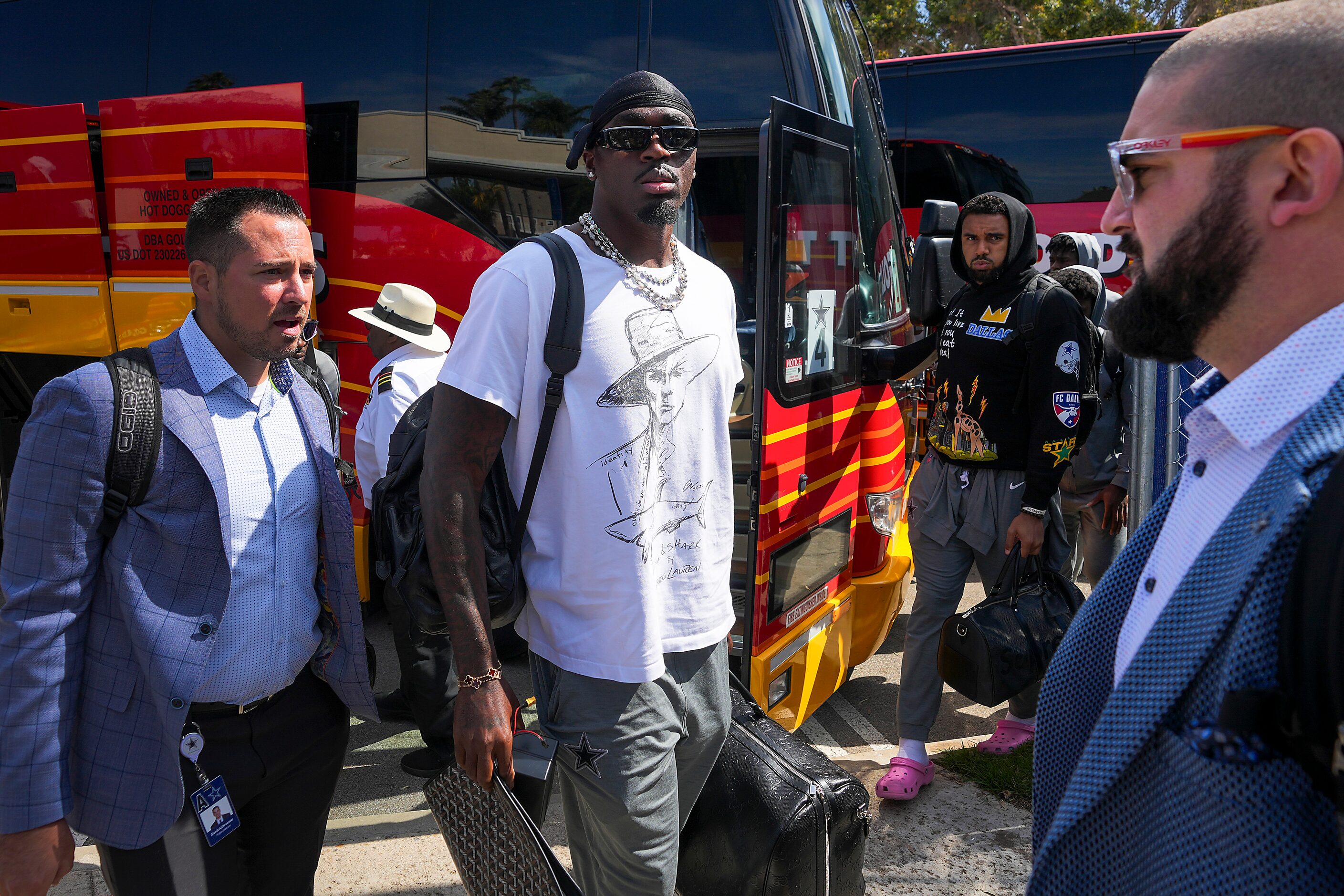 Dallas Cowboys safety Jayron Kearse exits one of the team buses as players arrive for...