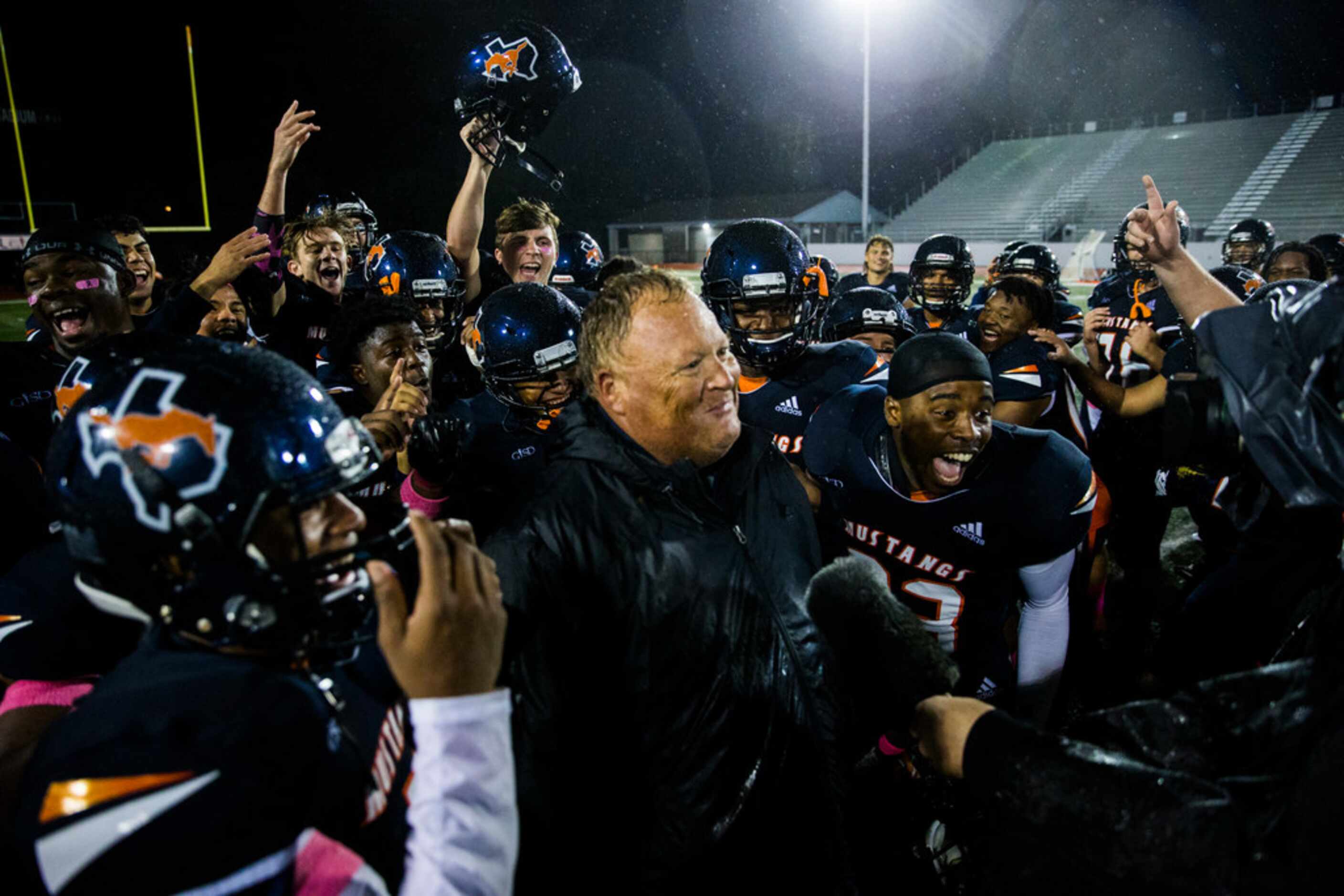 Sachse players celebrate a 17-14 win over Garland Lakeview with head coach Mark "Red"...