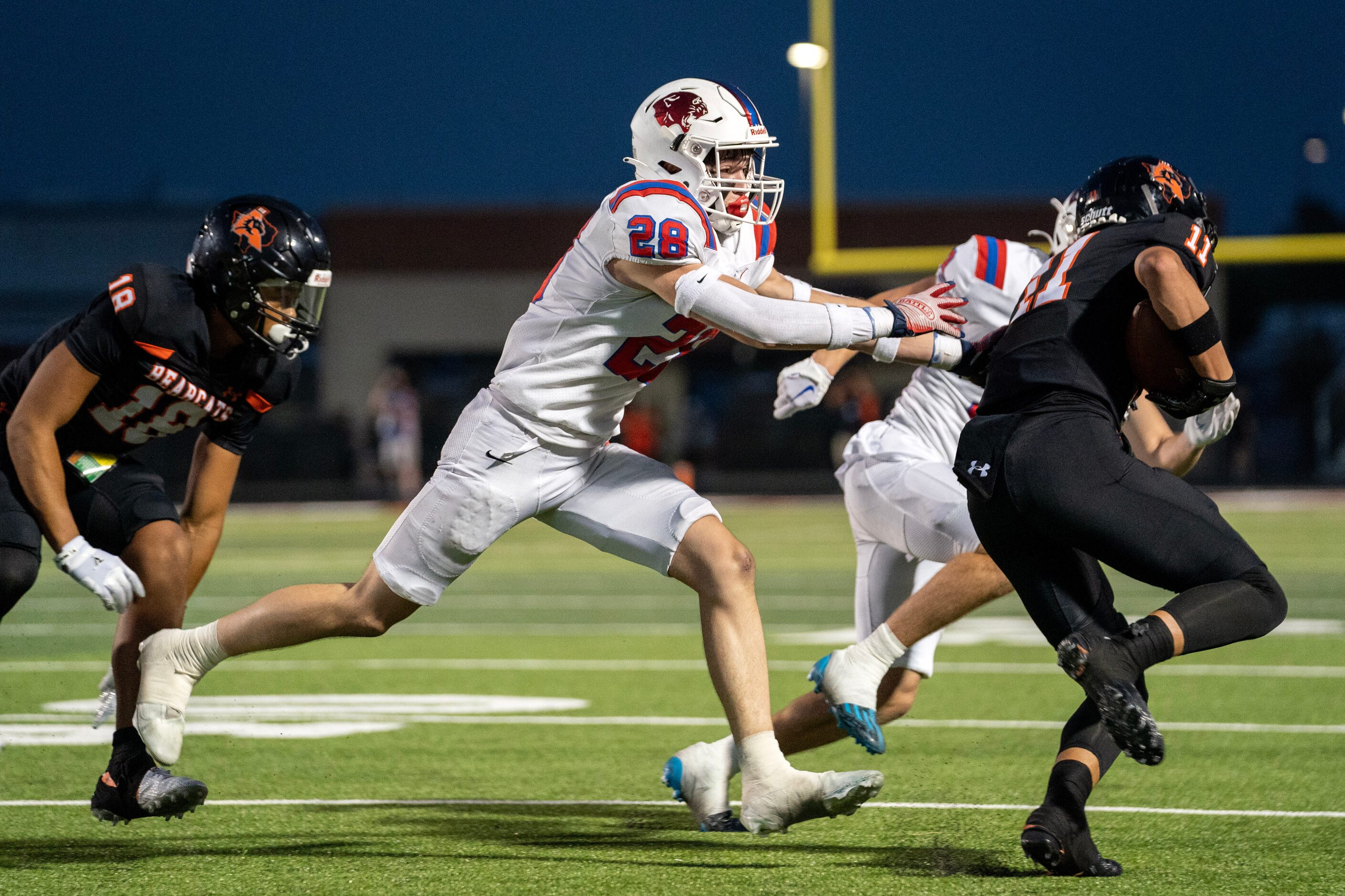 Parish Episcopal junior defensive back Guy Stern (28) tries to tackle Aledo senior wide...