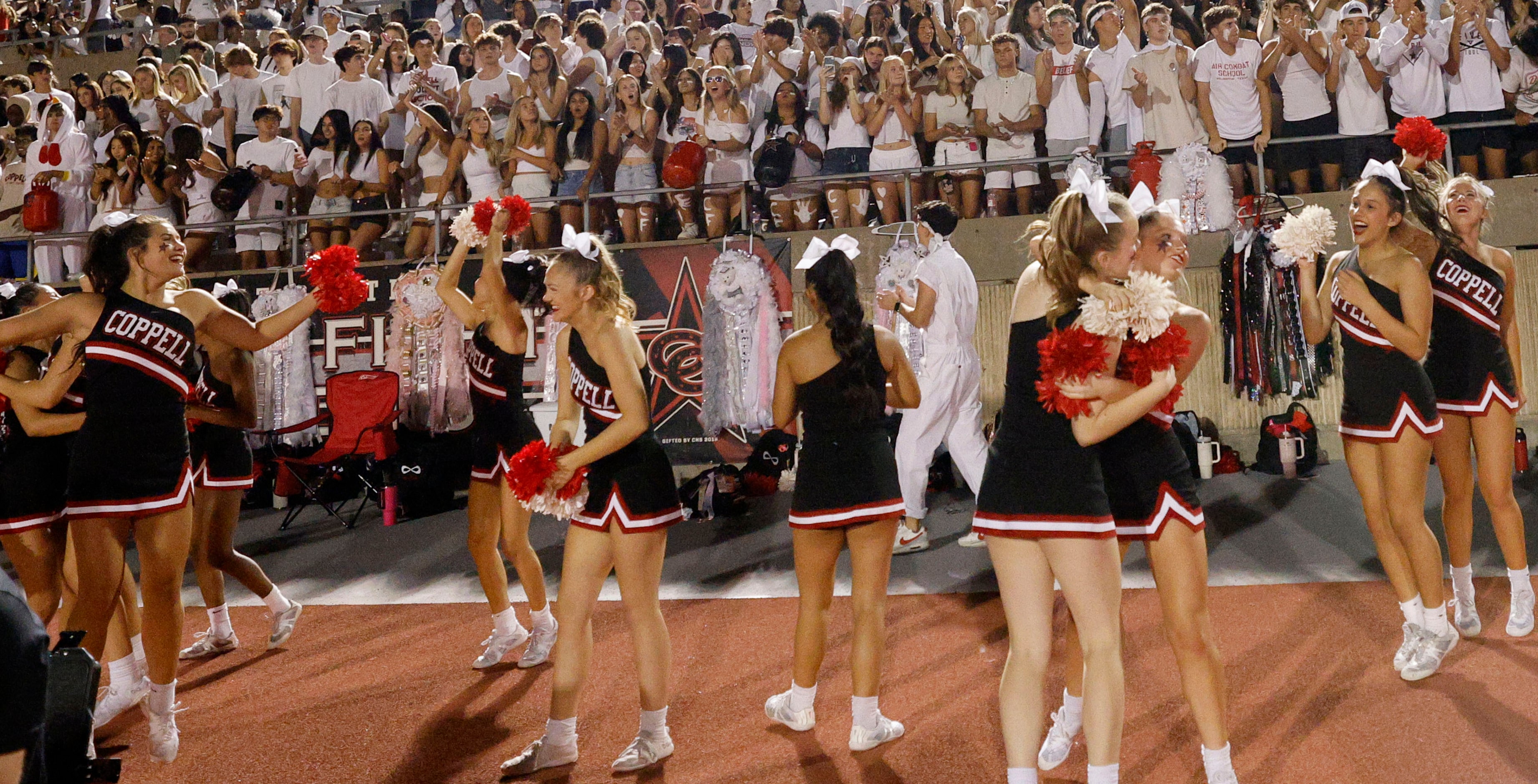 Coppell’s cheerleaders celebrate their 49-14 victory against Hebron after a high school...