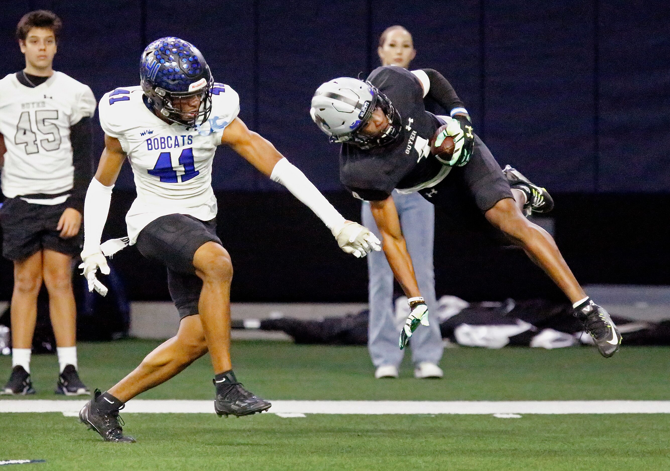 Guyer High School wide receiver Josiah Martin (4) pulls down a catch next to Byron Nelson...