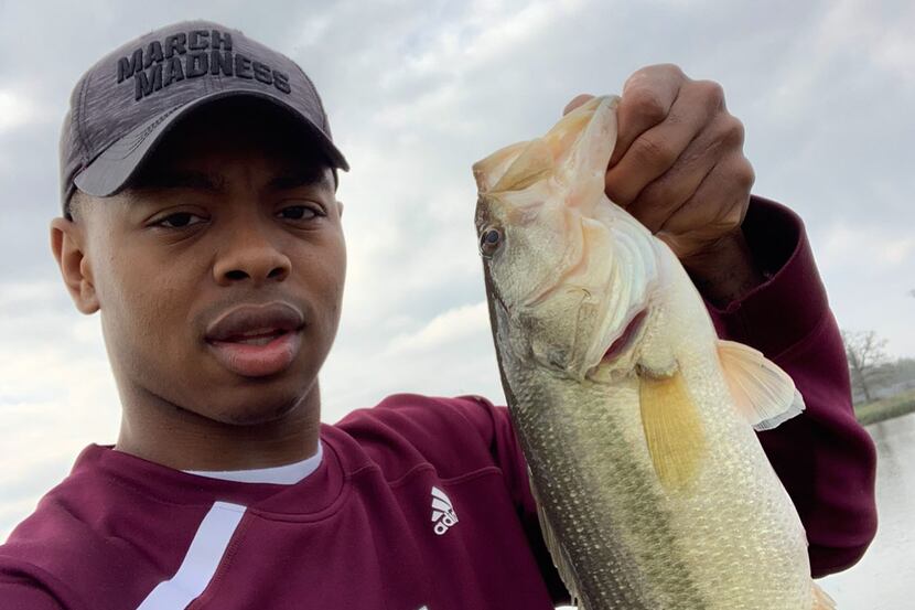 Texas A&M's Wendell Mitchell shows off his catch.