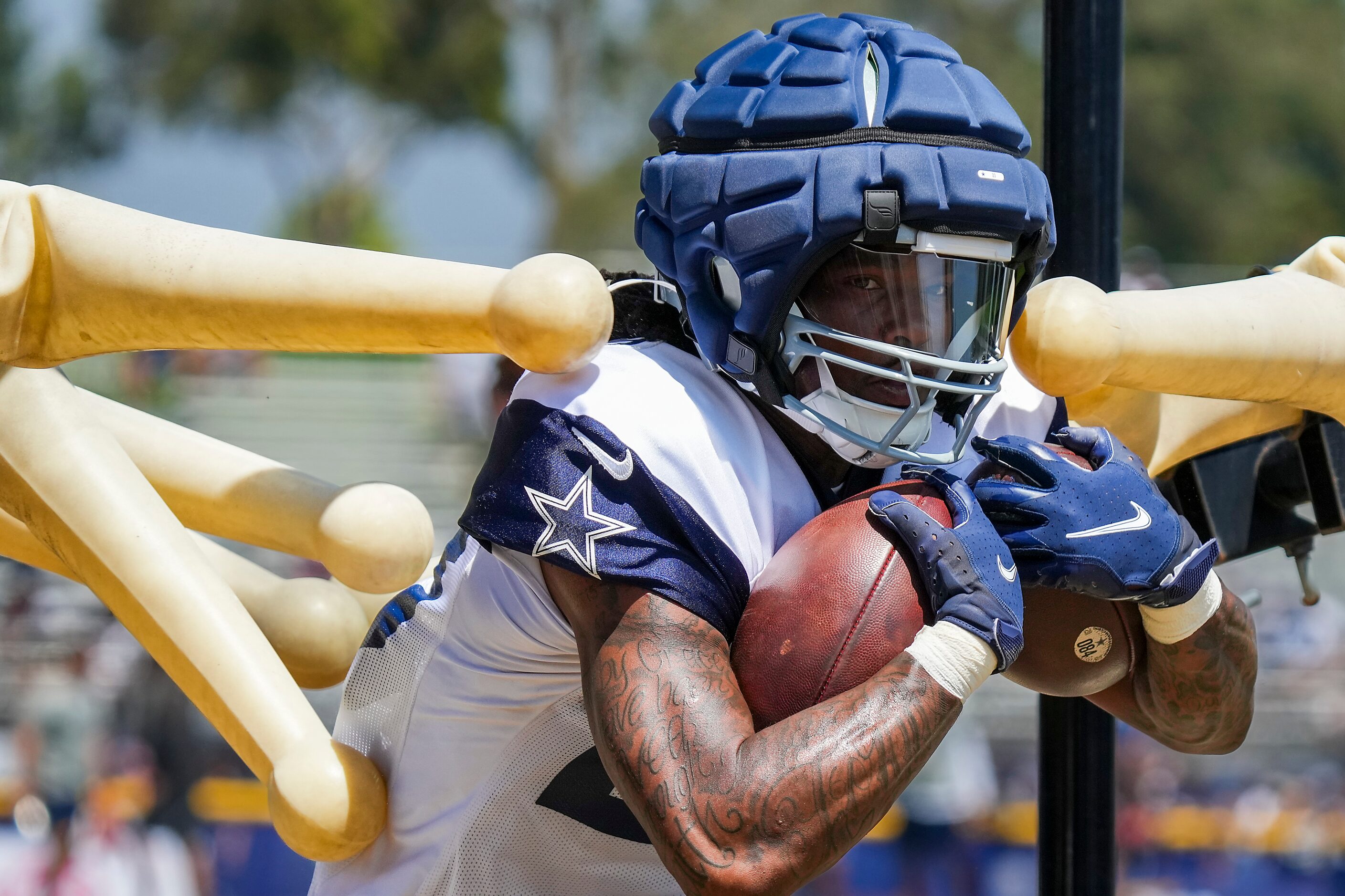 Dallas Cowboys running back Rico Dowdle (23) participates in a drill during a training camp...