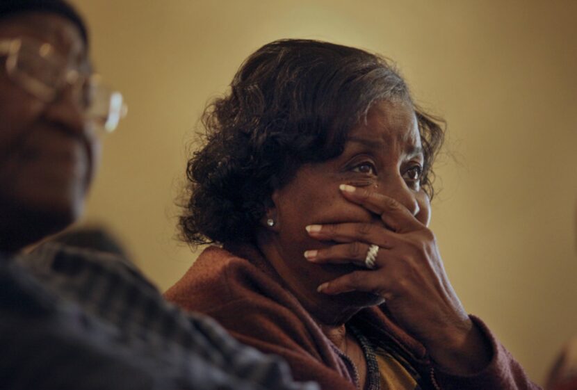 Lee Bertha Tittle listens to Otis Fagan, head of the Clean Association for Environmental...