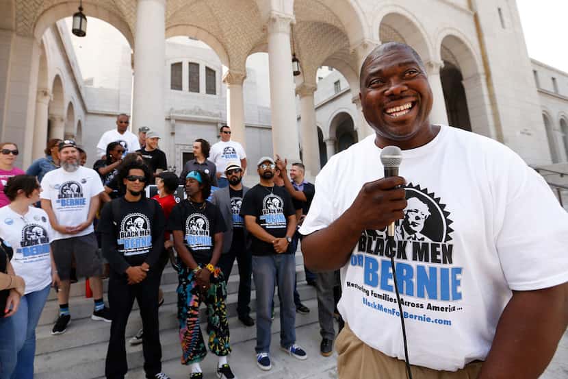 Bruce Carter, founder of "Black Men for Bernie," talks to supporters in front of Los Angeles...