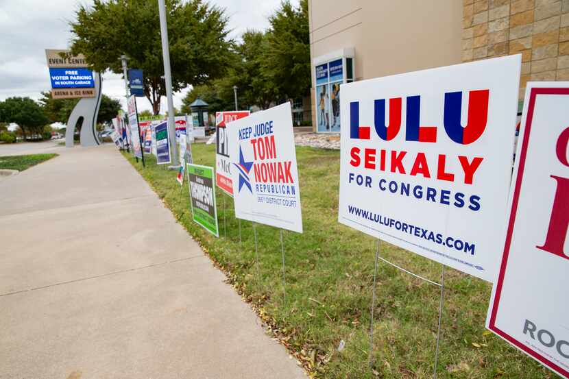 Political signs outside of the Allen Event Center in Allen on Thursday, Oct. 29, 2020. (Juan...