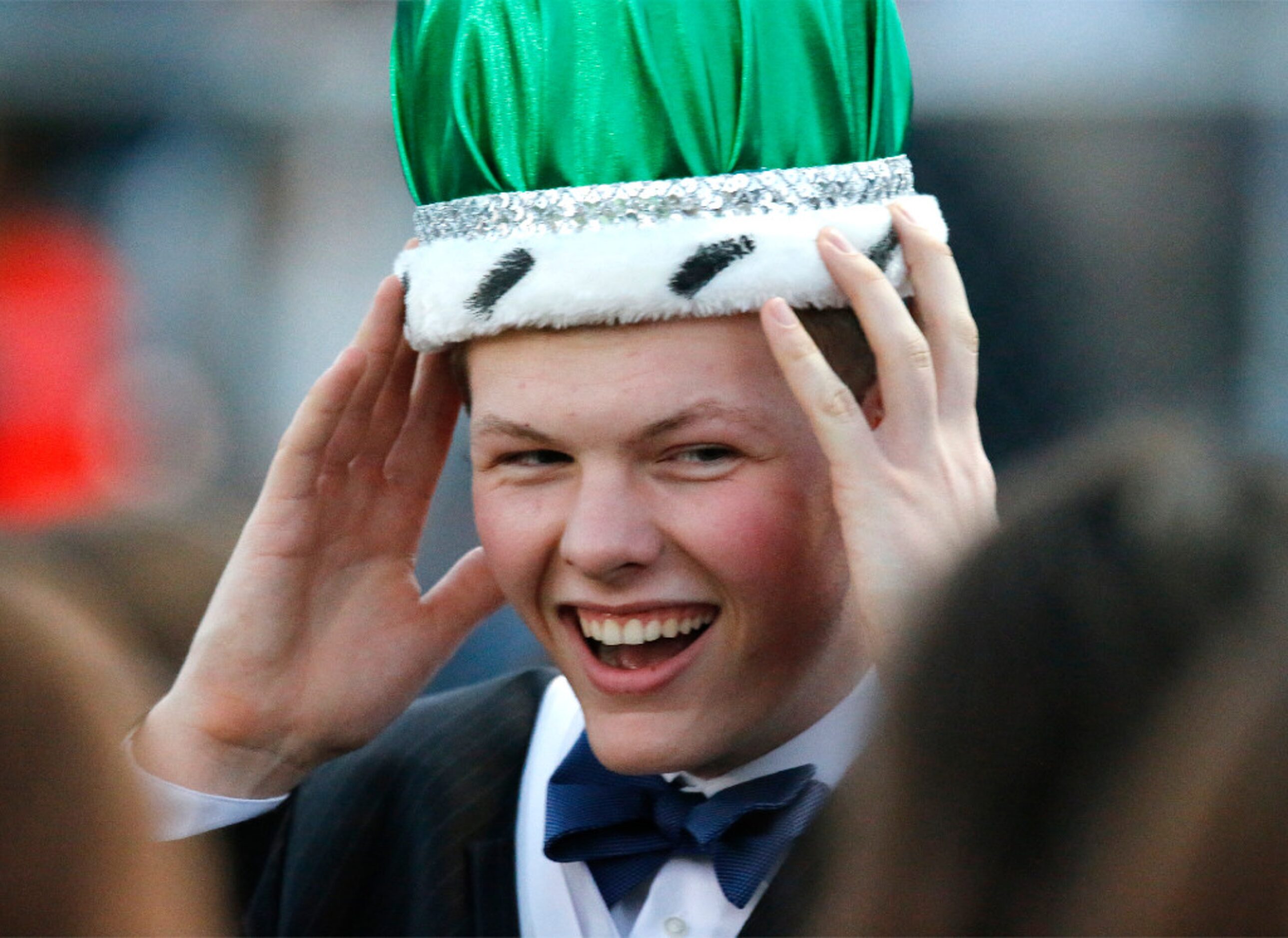 Prosper High School student Zack McConnell, 17, adjusts his crown after being crowned...