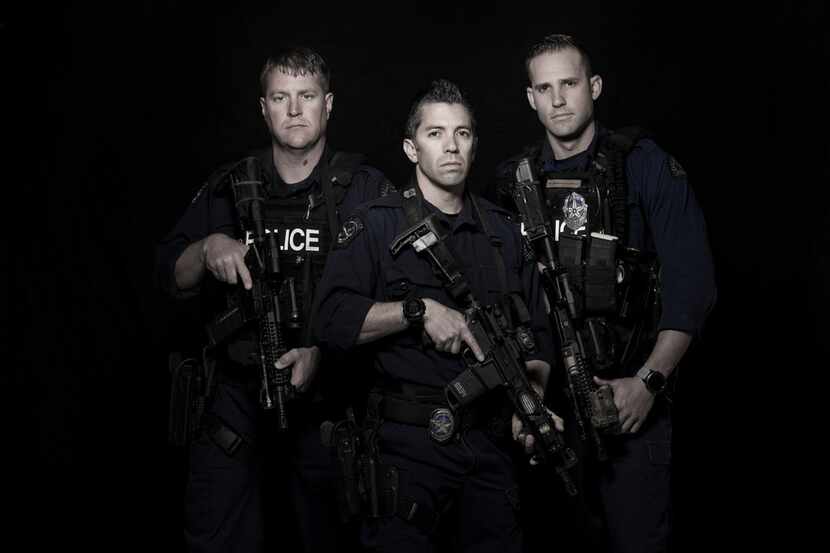 Dallas police SWAT team members Senior Cpl. Ryan Scott (from left), Senior Cpl. Danny Canete...