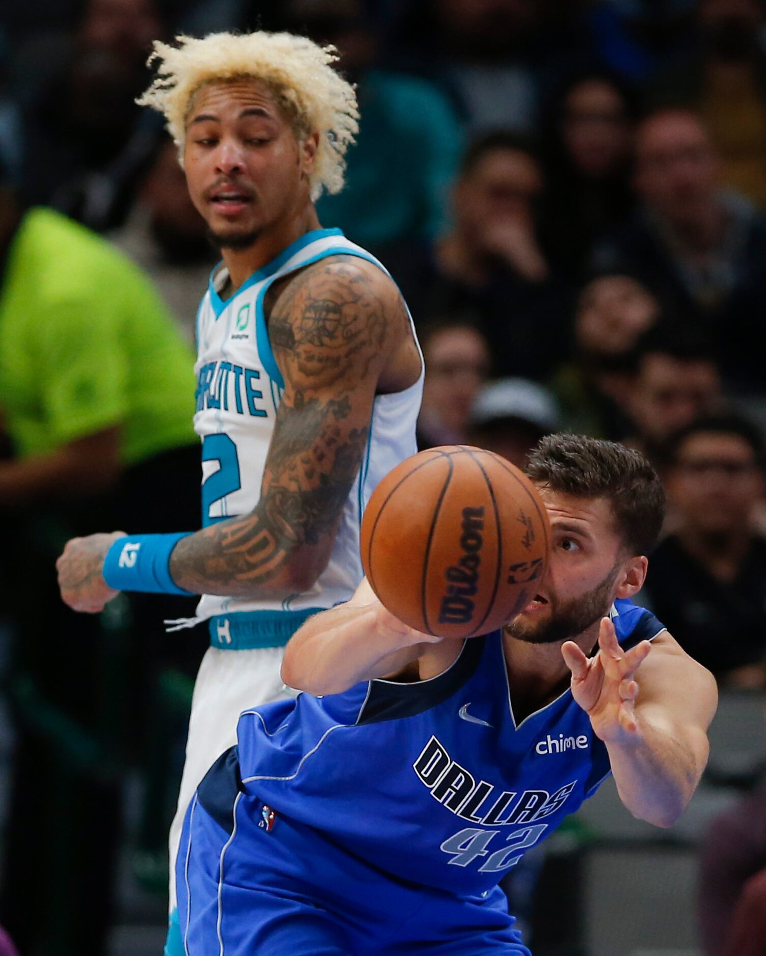 Dallas Mavericks forward Maxi Kleber (42) passes as Charlotte Hornets guard Kelly Oubre Jr....