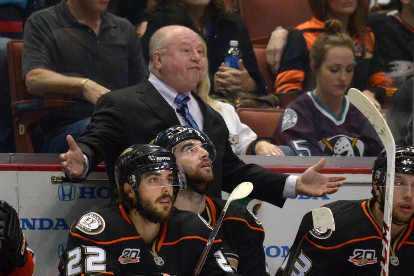 Apr 9, 2014; Anaheim, CA, USA; Anaheim Ducks coach Bruce Boudreau reacts from behind the...