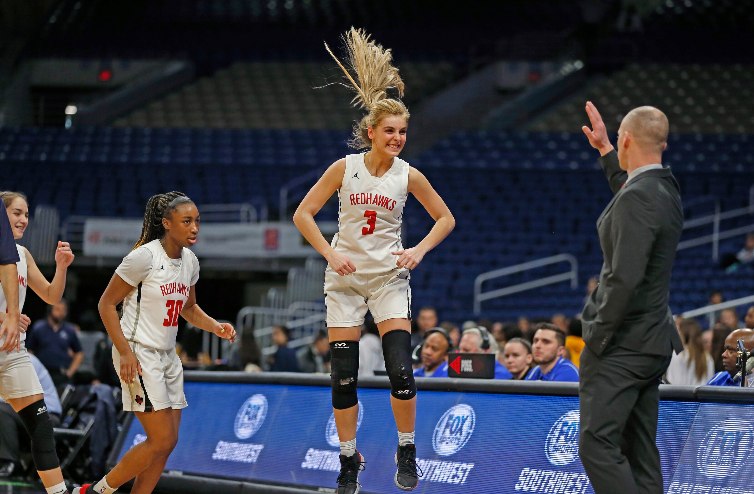 Frisco Liberty guard Lily Ziemkiewicz #3 and the rest of the starters come to the bench in...