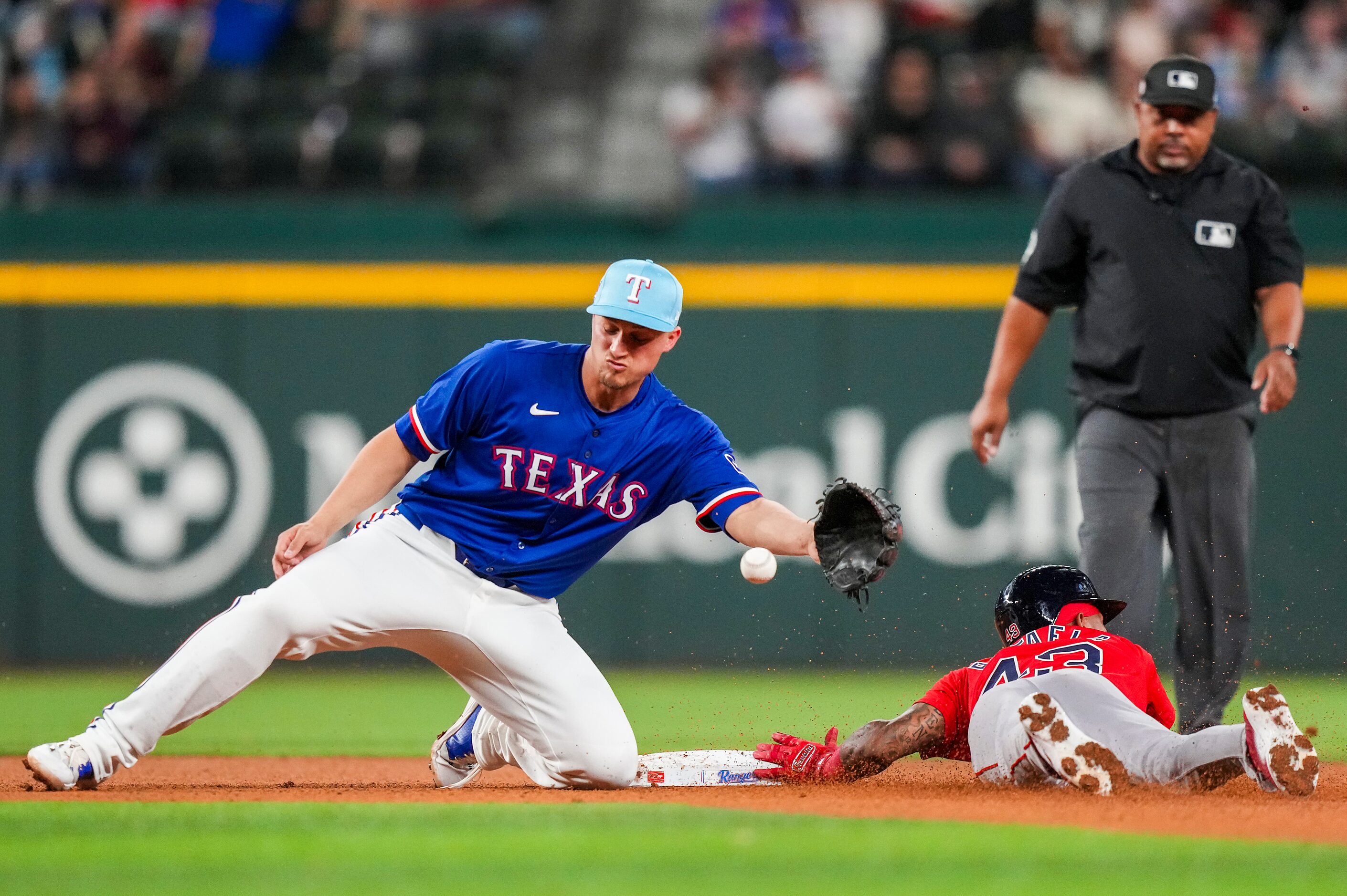 Boston Red Sox outfielder Ceddanne Rafaela steals second base ahead of the throw to Texas...