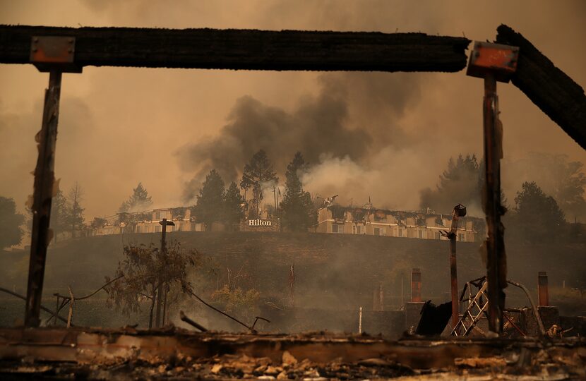 Smoke continues to ride from the Hilton Sonoma Wine Country on October 9, 2017 in Santa...