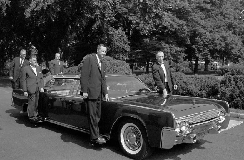 In June, 1961, U.S. Secret Service agents pose on retractable stands on President John F....