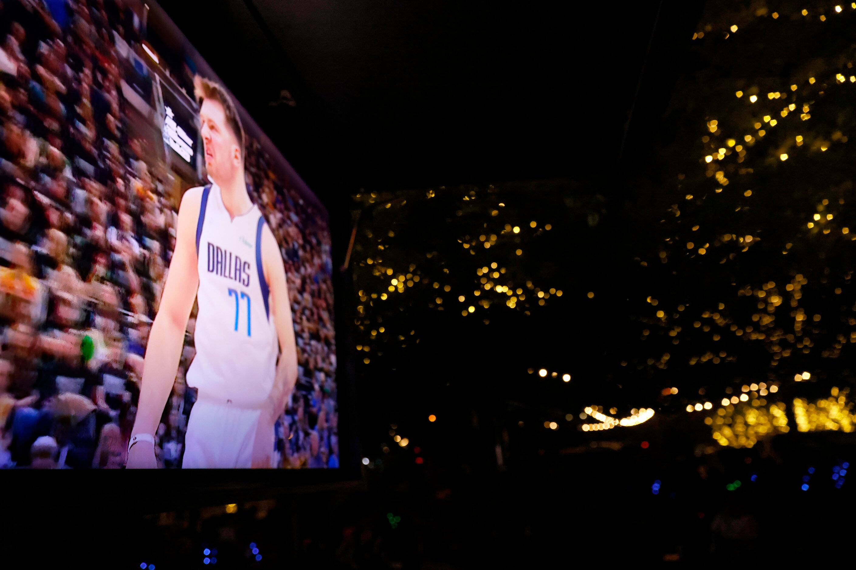 Dallas Mavericks guard Luka Doncic (on screen shows his grizzled face after scoring on the...