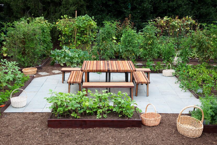 A  communal table anchors the gathering place in the middle of the White House Kitchen...