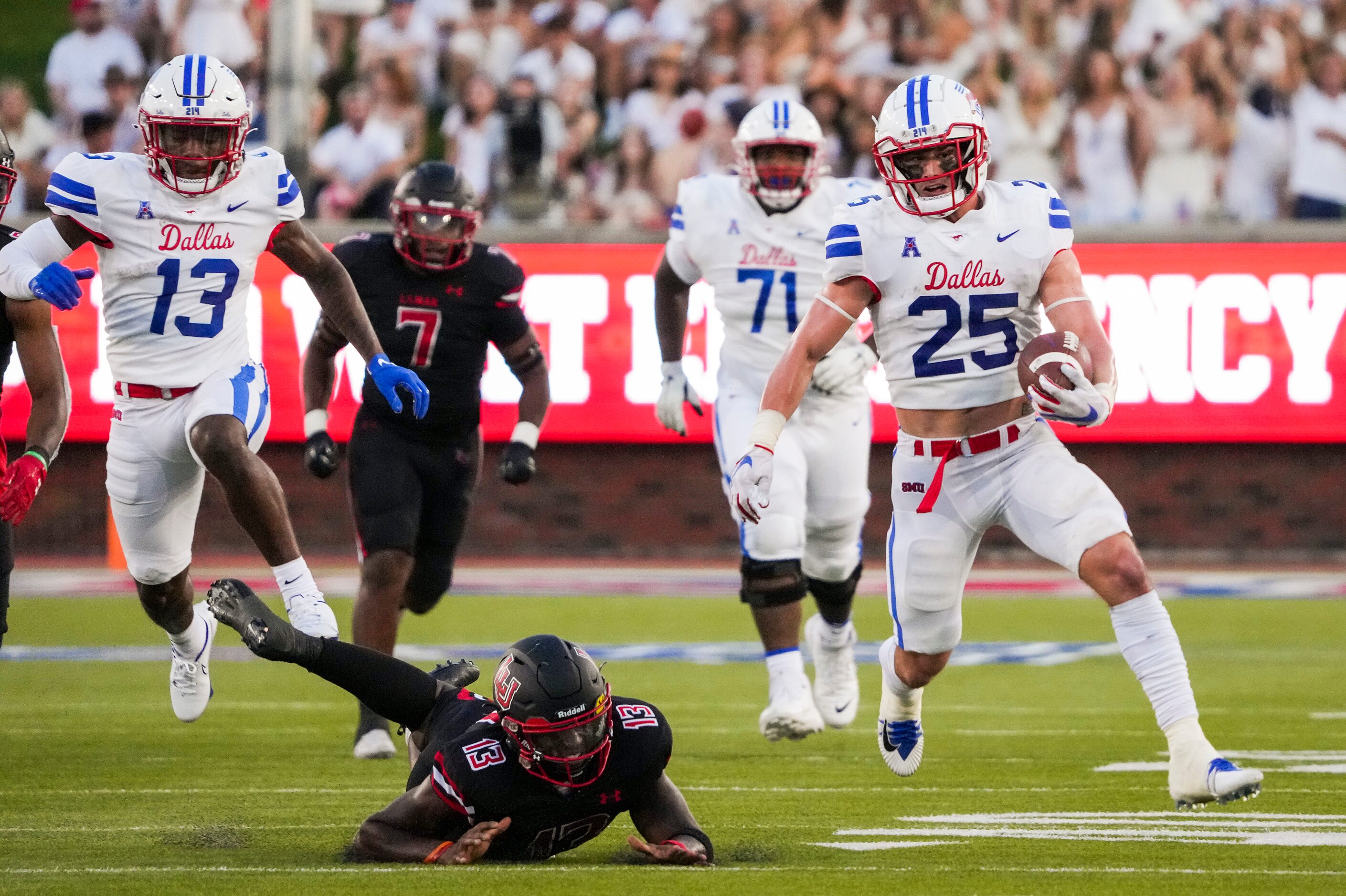 SMU running back TJ McDaniel (25) gets past Lamar defensive back Austin Goffney (13) on a...