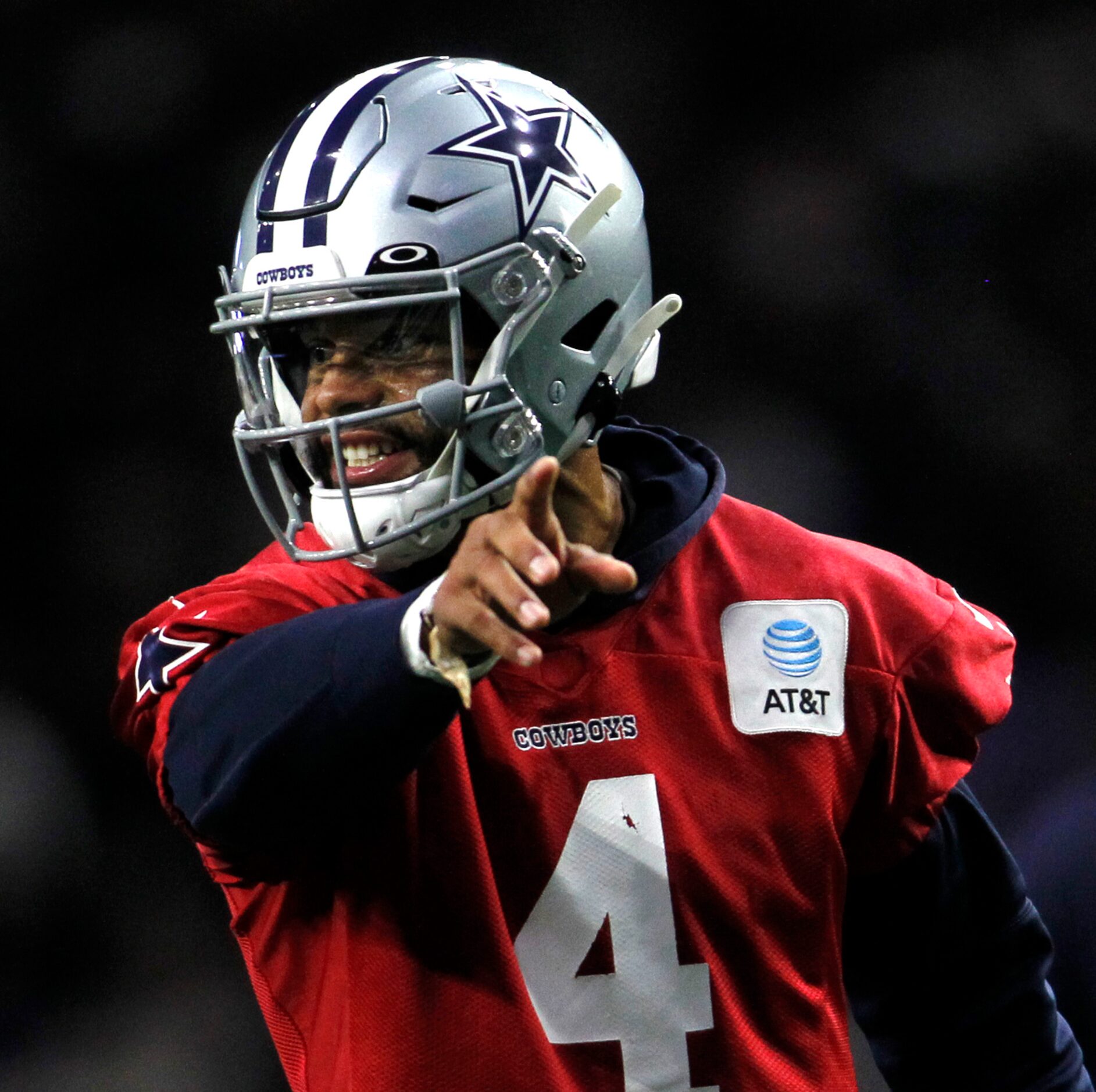 Dallas Cowboys quarterback Dak Prescott (4) directs a teammate during a practice session....