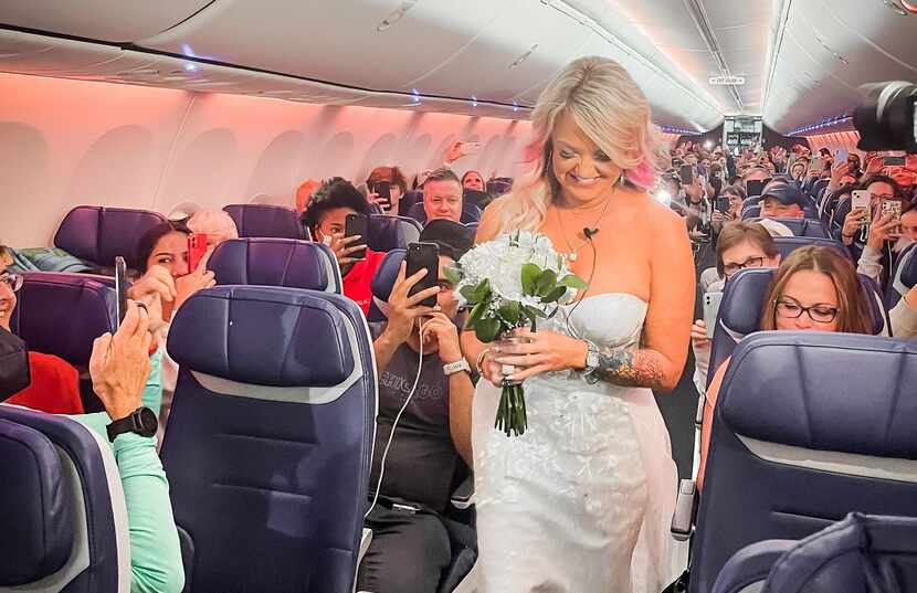 Pam Patterson of Oklahoma walks down the cabin aisle on Southwest Airlines flight 2690 on...