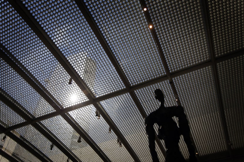 A photo taken last month shows light reflecting off Museum Tower through the Nasher...