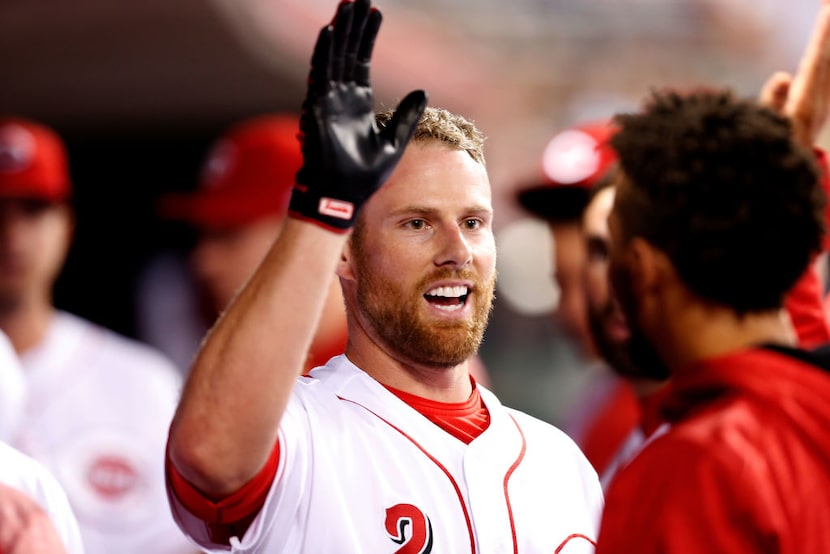 CINCINNATI, OH - SEPTEMBER 15:  Zack Cozart #2 of the Cincinnati Reds is congratulated by...