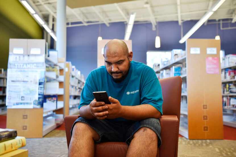 Victor Moreno, 26, browsed for job listings while using the free Wi-Fi at the Pleasant Grove...