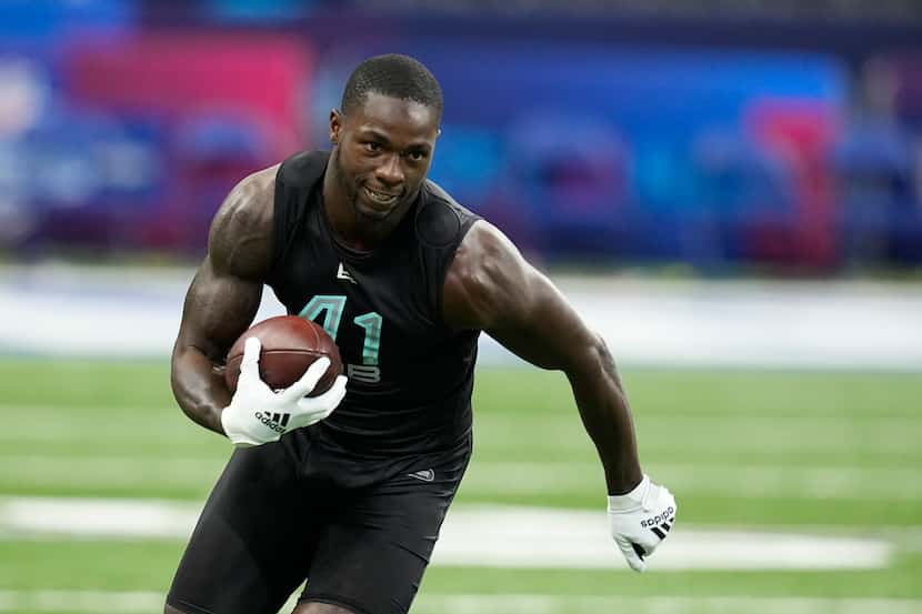 Florida A&M safety Markquese Bell runs a drill during the NFL football scouting combine,...