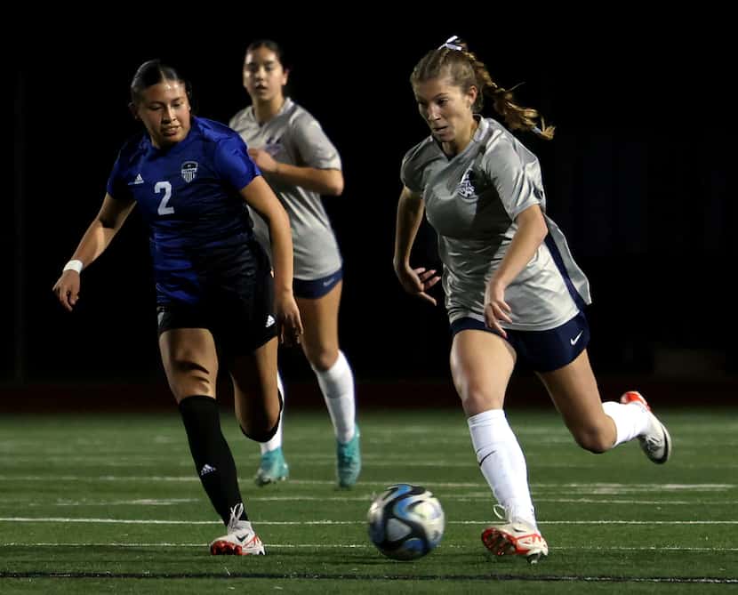 Flower Mound midfielder Ally Pinto (5), right, controls the ball as she is defended by...