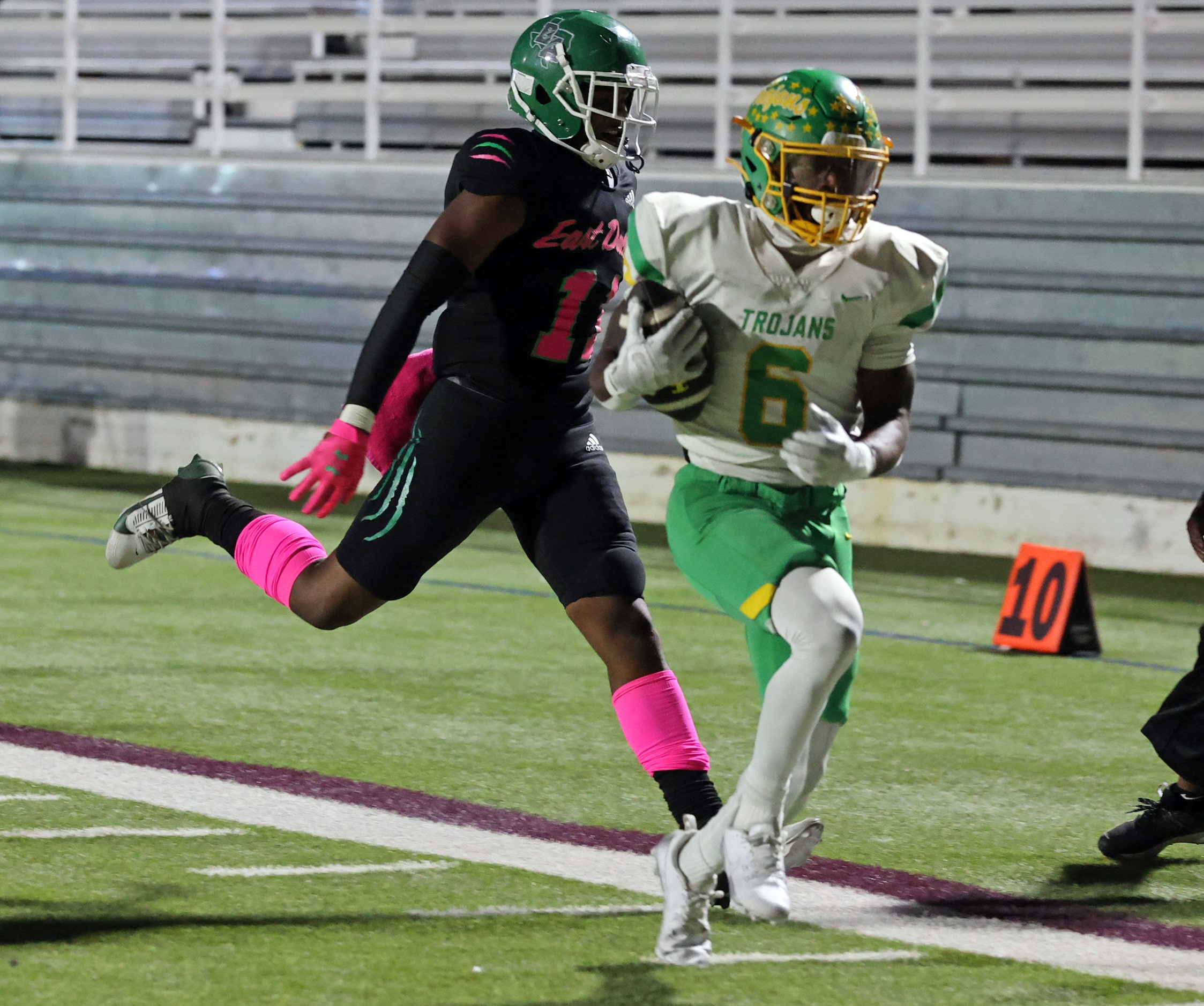 Newman Smith High RB Allijah Harrison (6) scores a touchdown, trailed by a Bryan Adams...