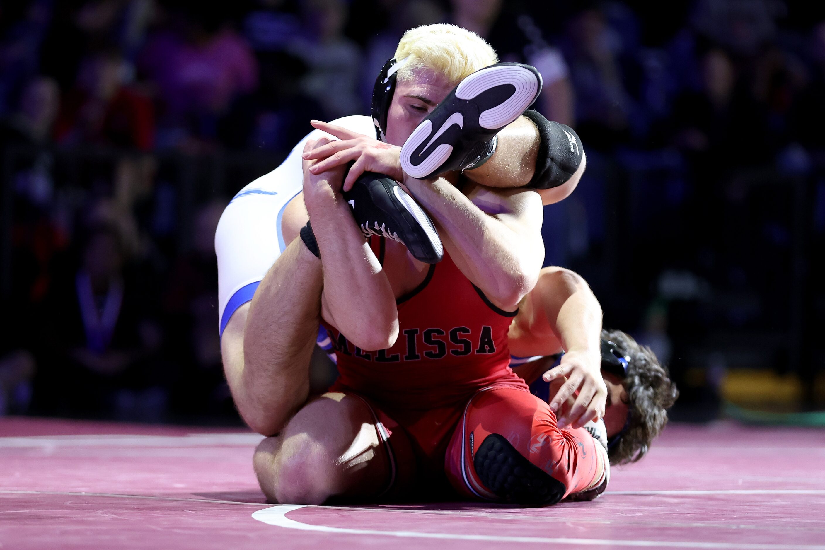 Angelo Ferrari of Melissa (red) competes against Isaac Zapata of Georgetown in the Boys 5A...